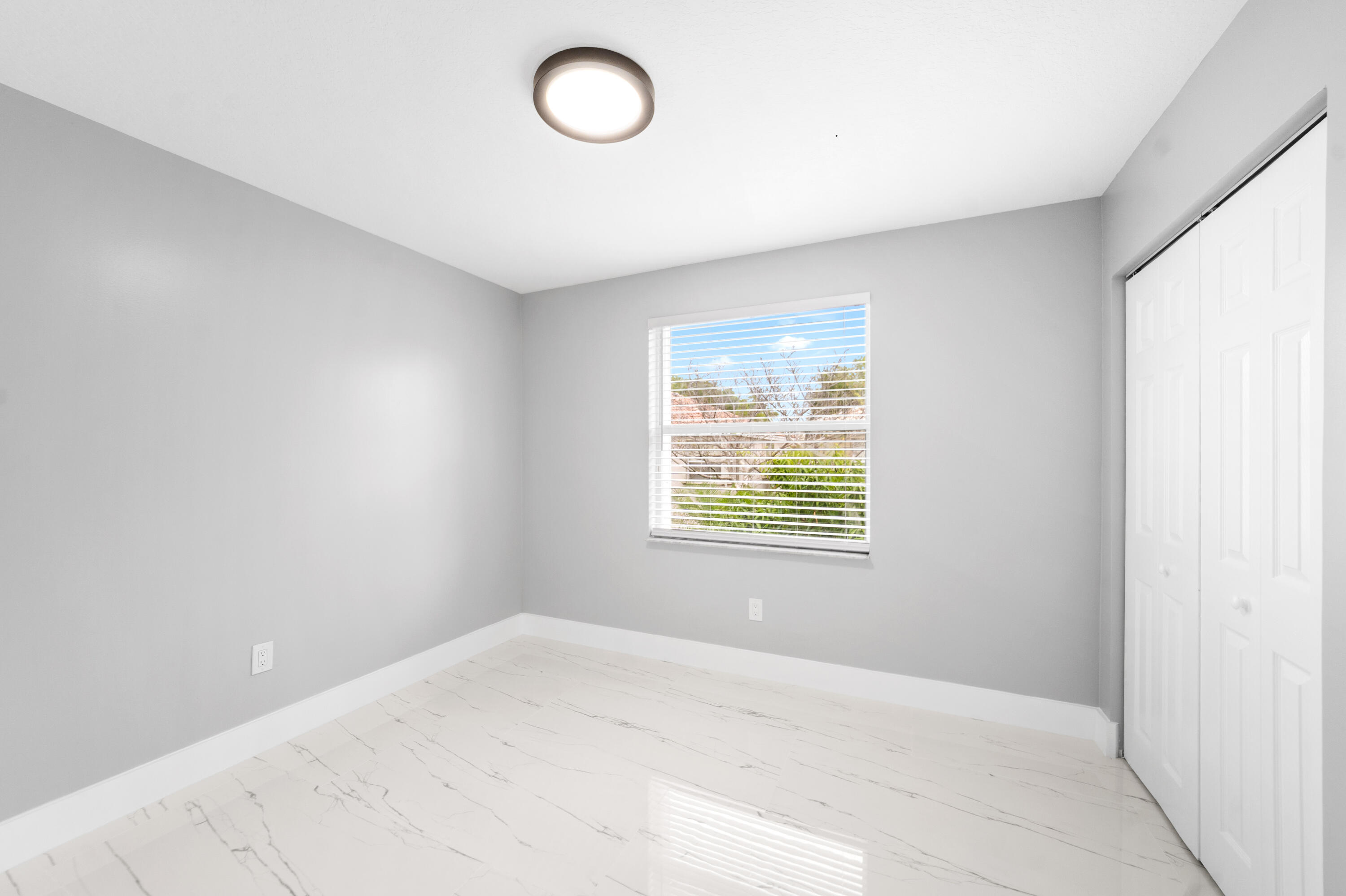 5233 Southwest 155th Way Miramar, FL 33027 - Photo 28 of 63 an empty room with windows