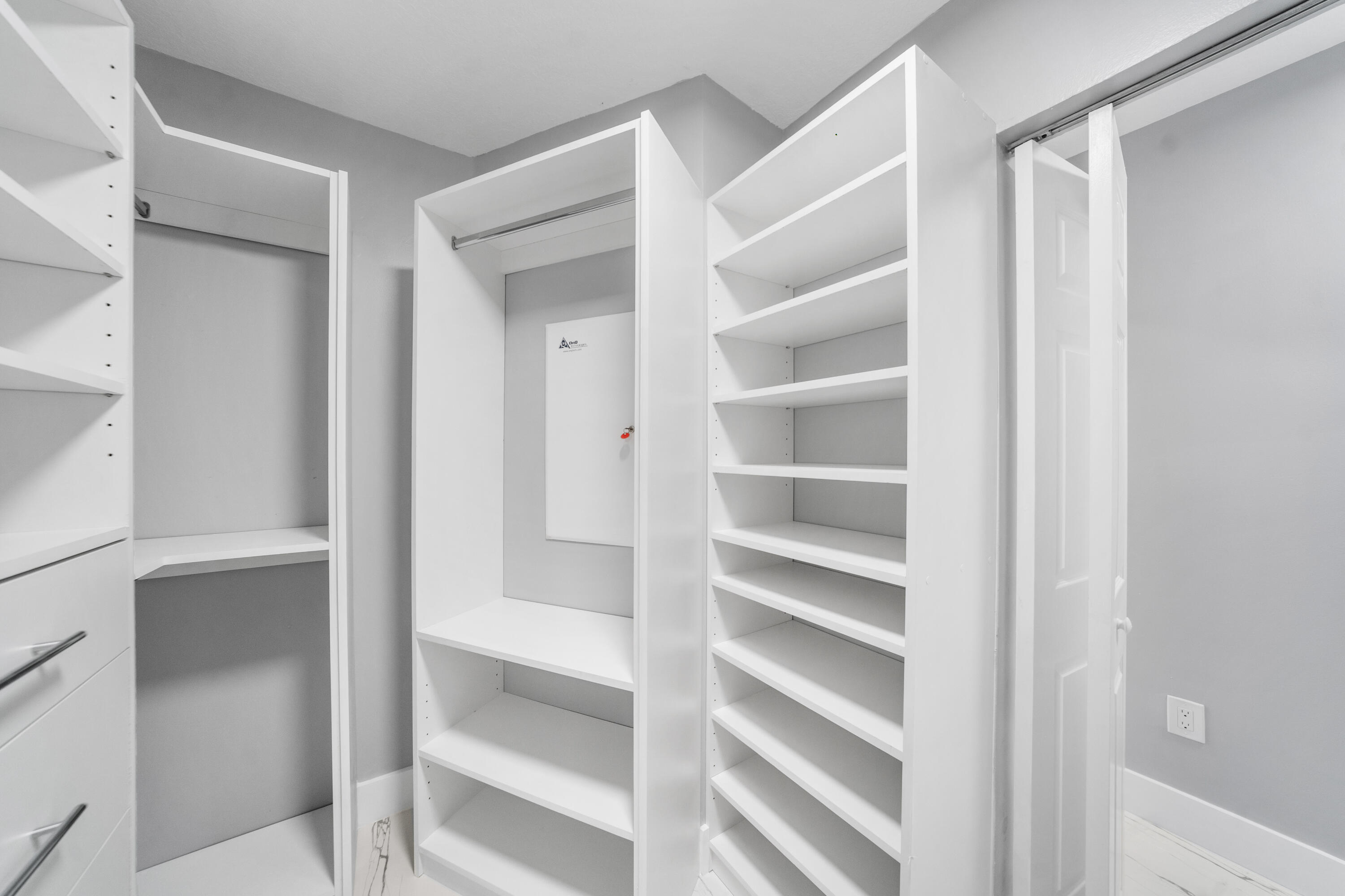 5233 Southwest 155th Way Miramar, FL 33027 - Photo 31 of 63 a view of walk in closet with empty racks