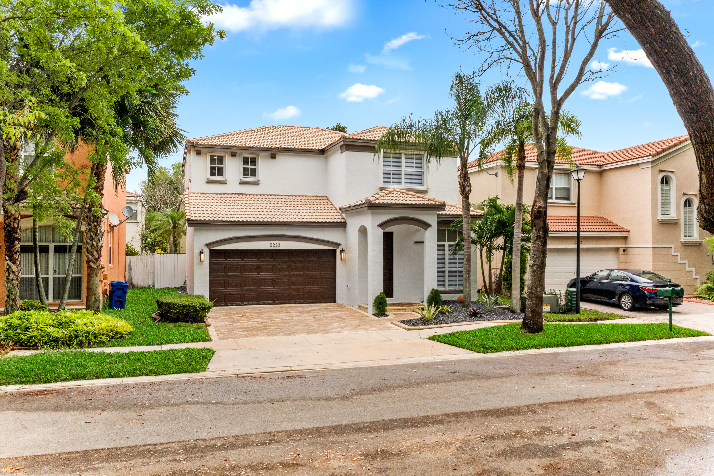 5233 Southwest 155th Way Miramar, FL 33027 - Photo 51 of 63 a front view of a house with yard and green space