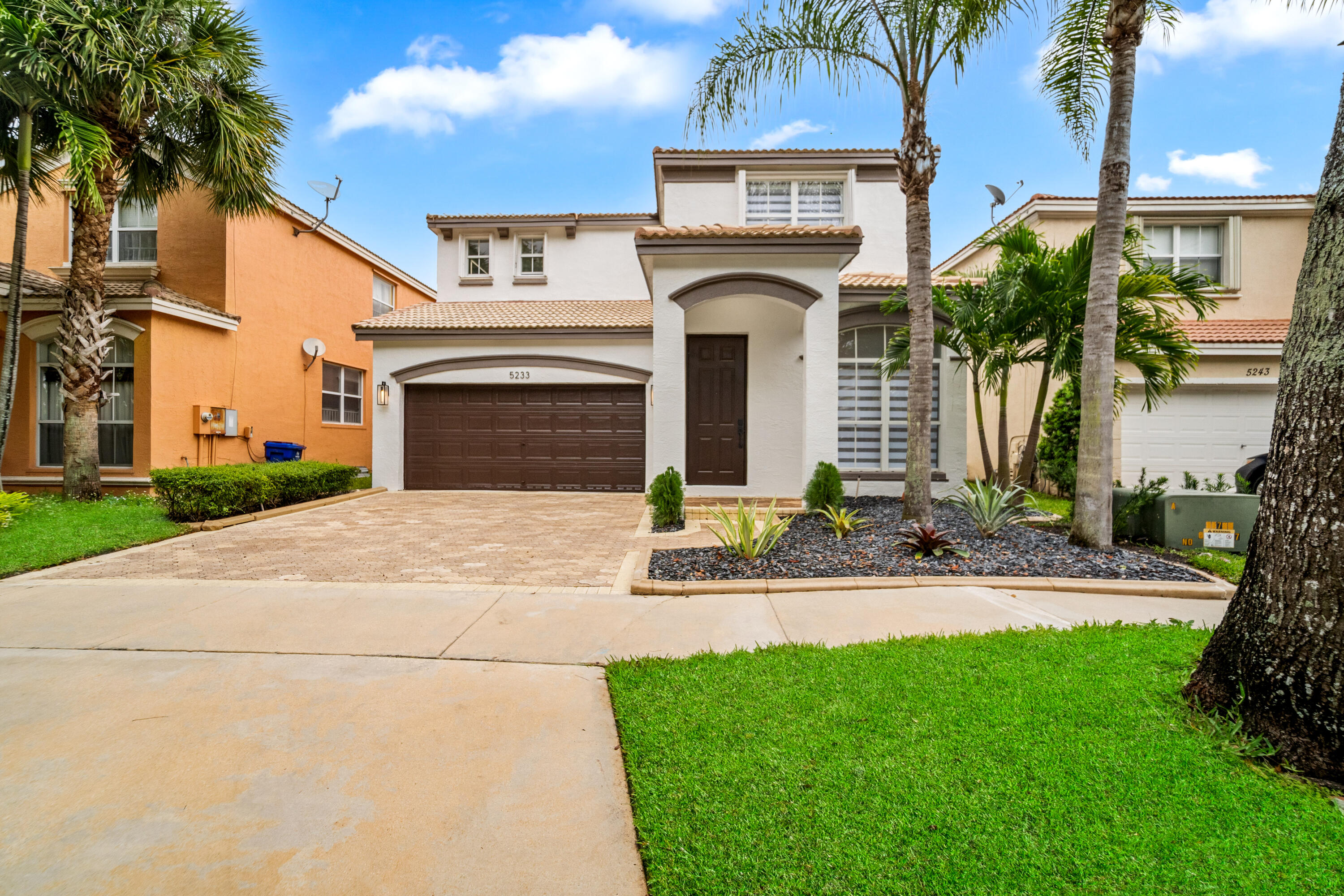 5233 Southwest 155th Way Miramar, FL 33027 - Photo 57 of 63 a front view of a house with garden