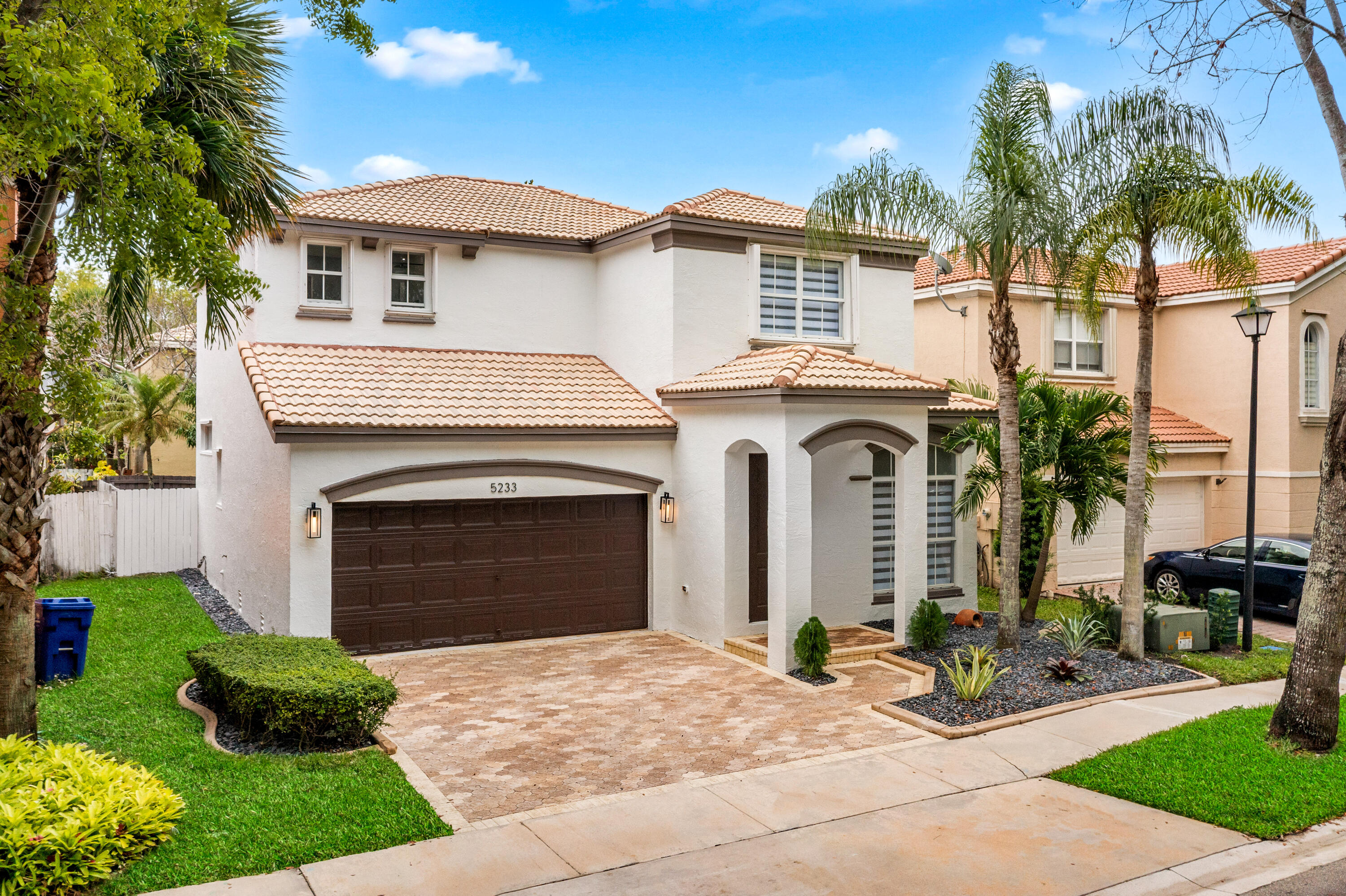 5233 Southwest 155th Way Miramar, FL 33027 - Photo 60 of 63 a front view of a house with yard and parking