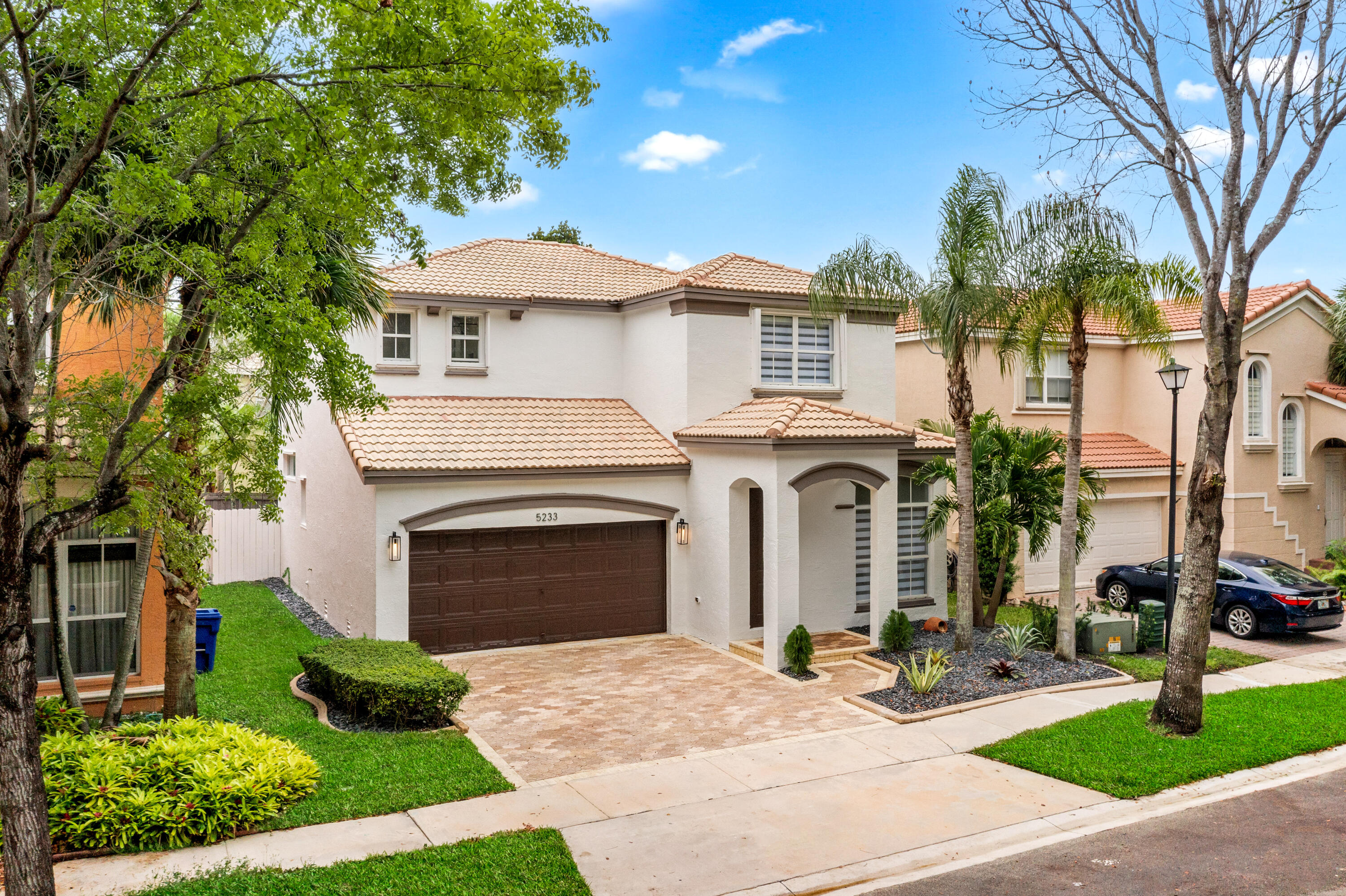 5233 Southwest 155th Way Miramar, FL 33027 - Photo 61 of 63 a front view of a house with yard and green space