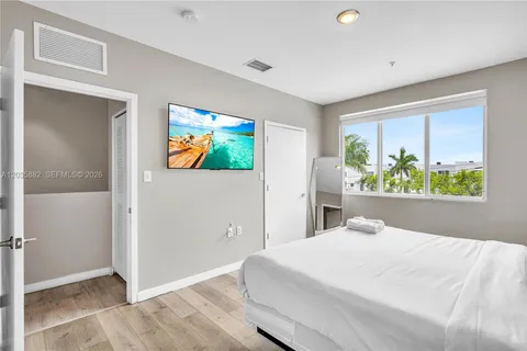 a bedroom with a bed and a view of bedroom