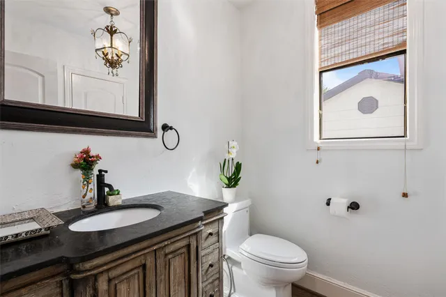 a outdoor space with a large window and furniture