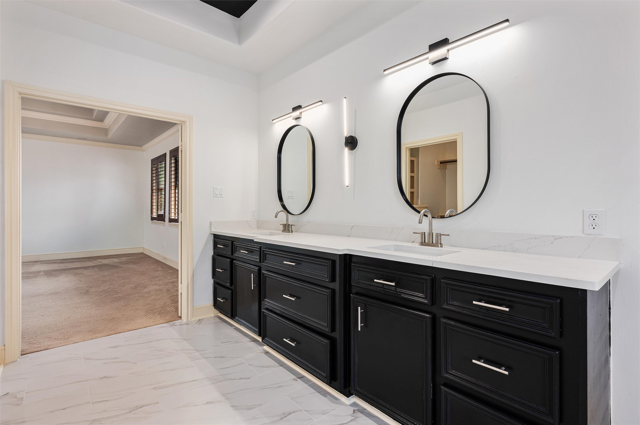 4523 Maple Street Bellaire, TX 77401 - Photo 27 of 50 The vanity provides ample cabinets and drawers for storage, along with generous countertop space for all your essentials.