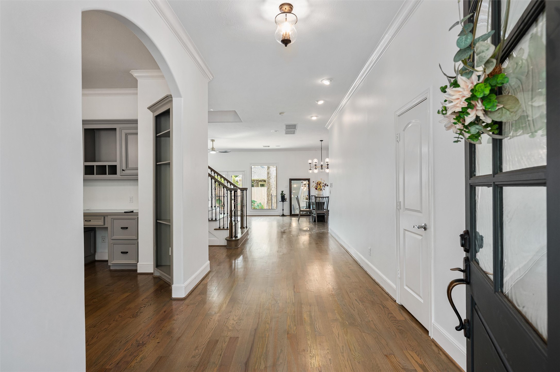 4523 Maple Street Bellaire, TX 77401 - Photo 4 of 50 Step inside to discover fresh designer paint, beautiful hardwood floors flowing throughout, and thoughtful details that create a welcoming first impression.