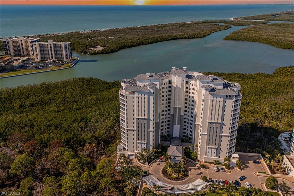 295 Grande Way, Unit PH2 Naples, FL 34110 - Photo 42 of 45 a view of a lake with a mountain view
