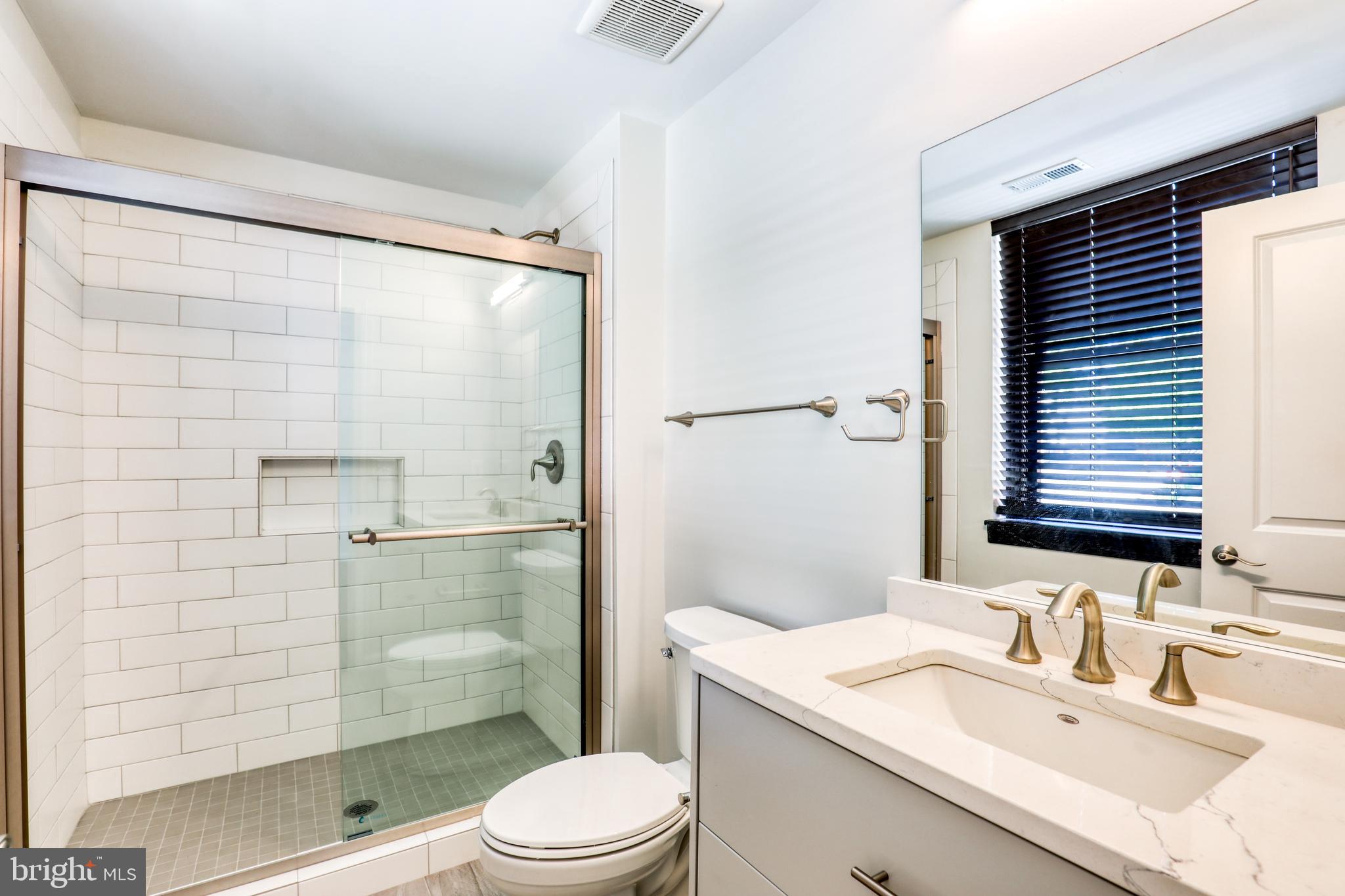 210 East Boscawen Street, Unit 204 Winchester, VA 22601 - Photo 16 of 20 a bathroom with a sink toilet and shower