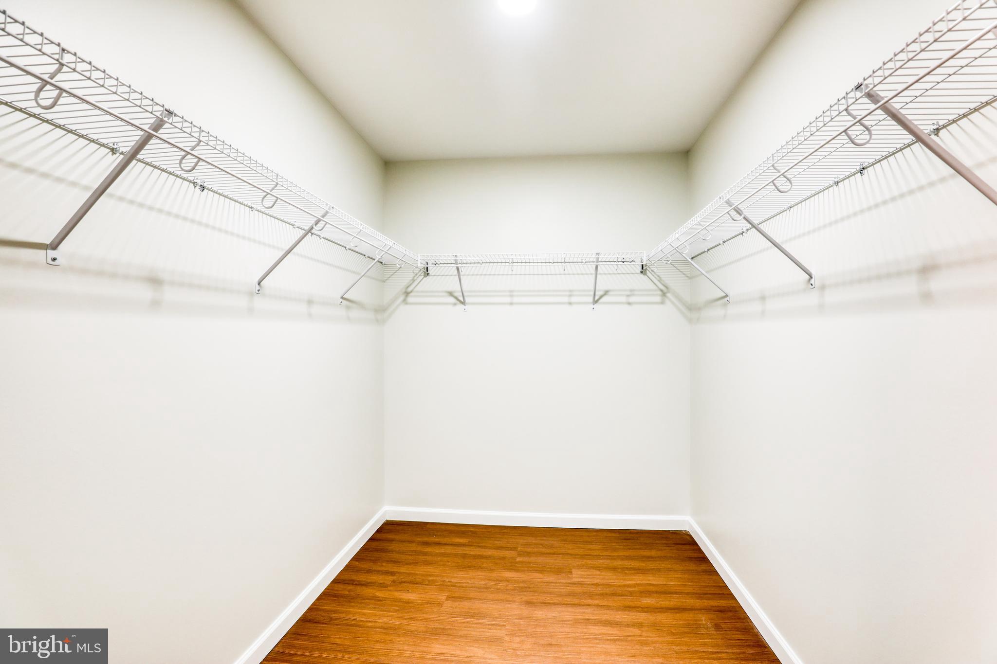 210 East Boscawen Street, Unit 204 Winchester, VA 22601 - Photo 17 of 20 a view of a room with racks on the wall
