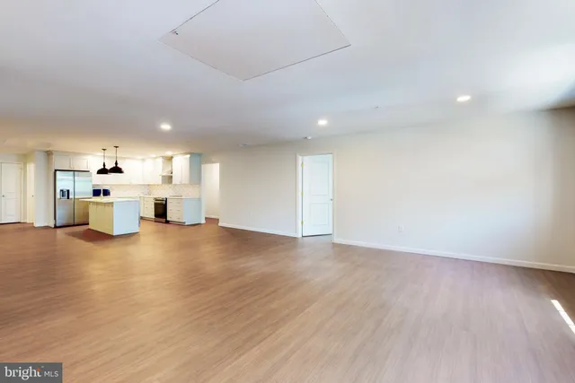 a view of kitchen with furniture and wooden floor