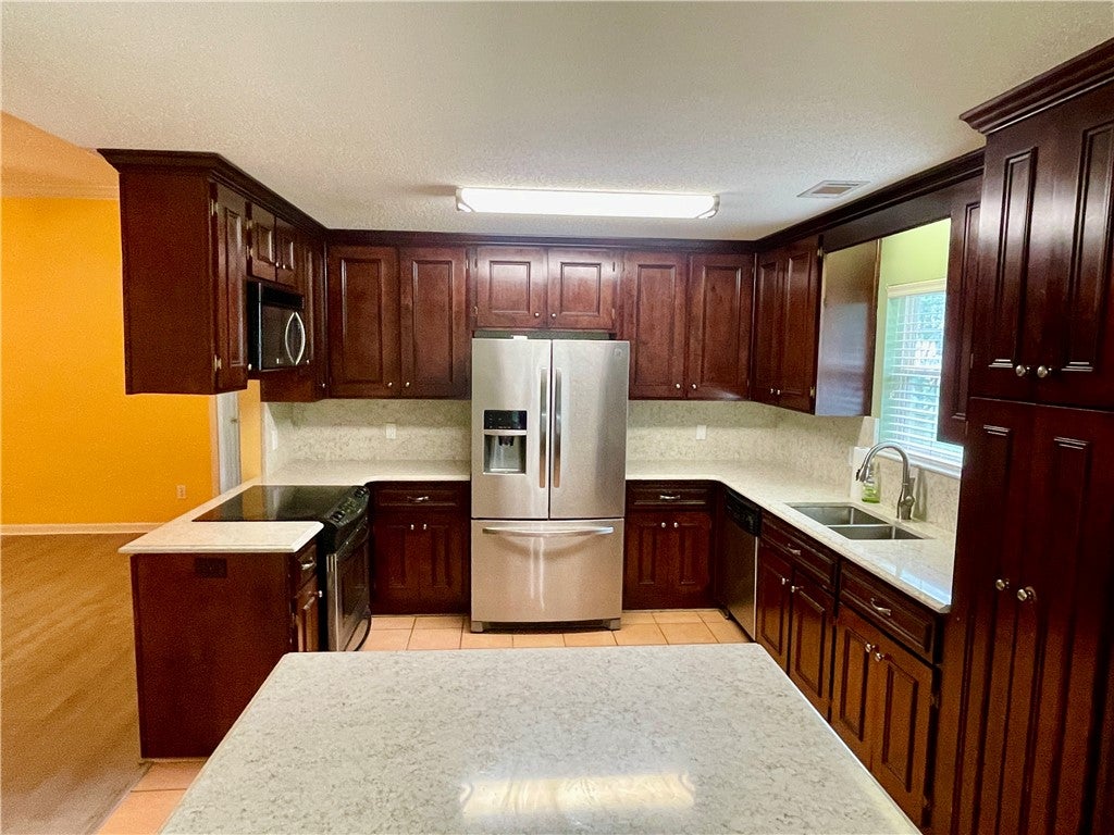 702 Rustic Street Opelika, AL 36801 - Photo 10 of 29 Stainless appliances remain