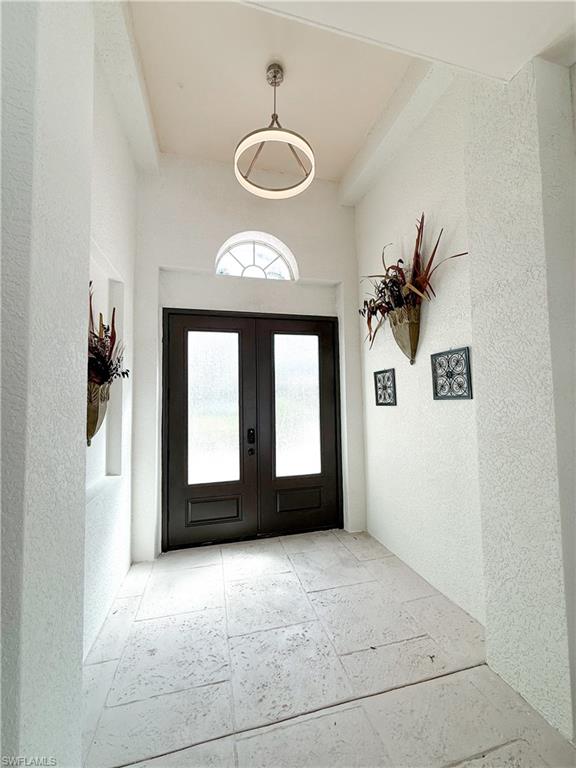 516 Eagle Creek Drive Naples, FL 34113 - Photo 3 of 28 a view of an empty room with a window
