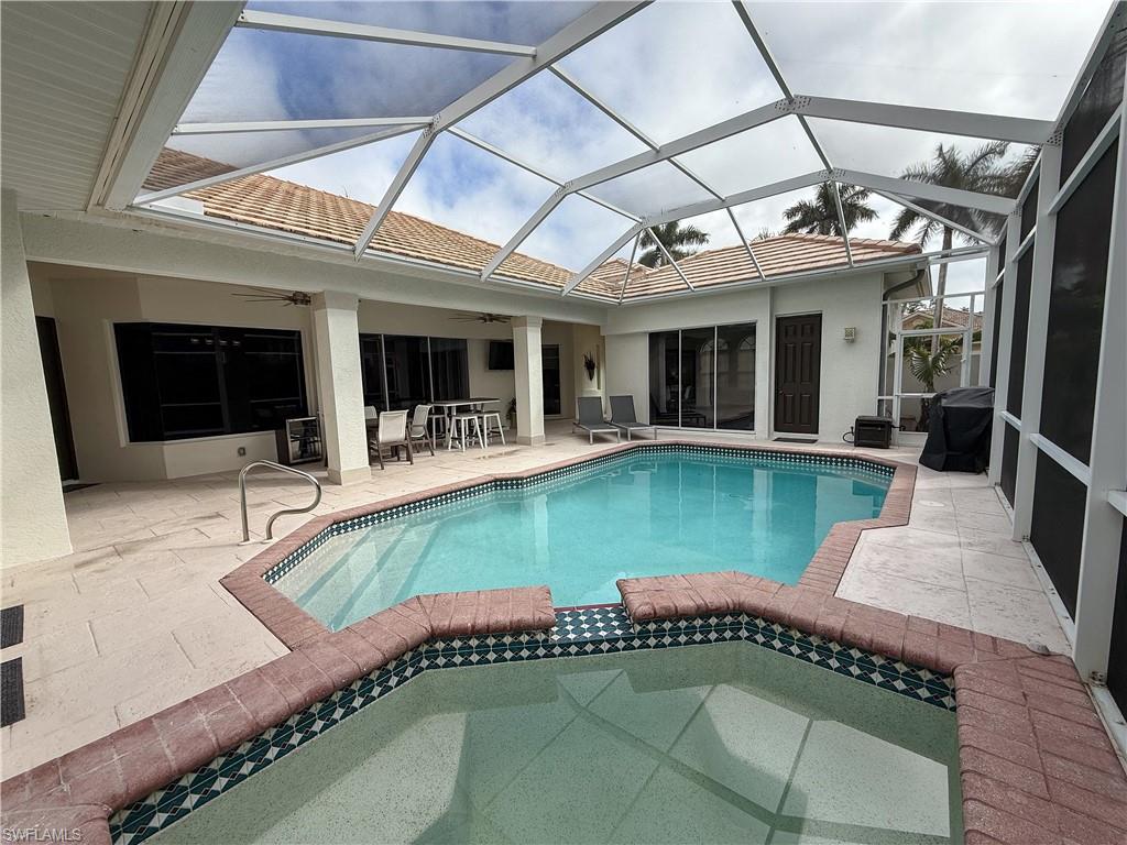 516 Eagle Creek Drive Naples, FL 34113 - Photo 5 of 28 a view of a house with swimming pool