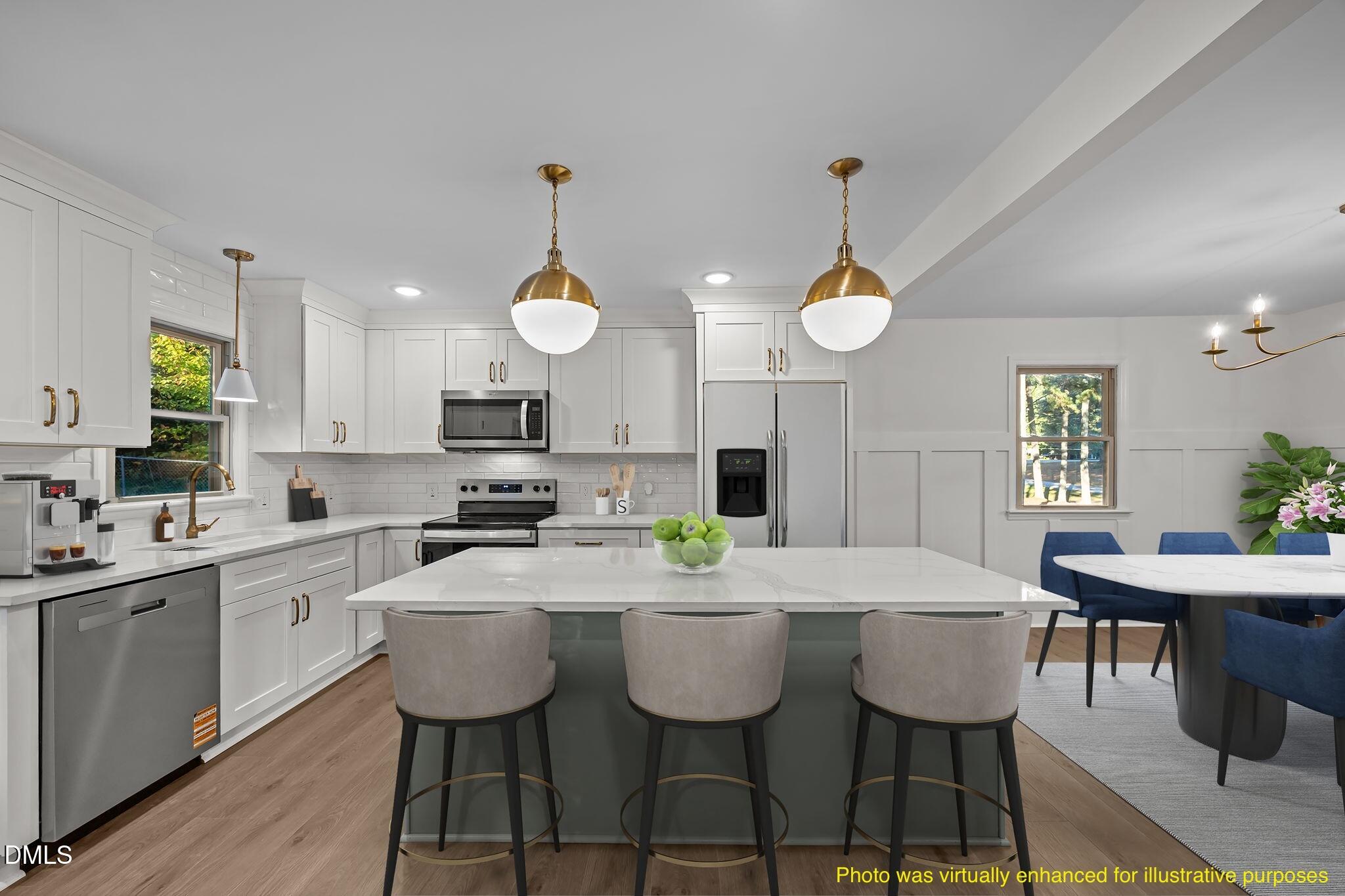102 Royall Road Oxford, NC 27565 - Photo 11 of 53 a kitchen with a dining table chairs and white cabinets