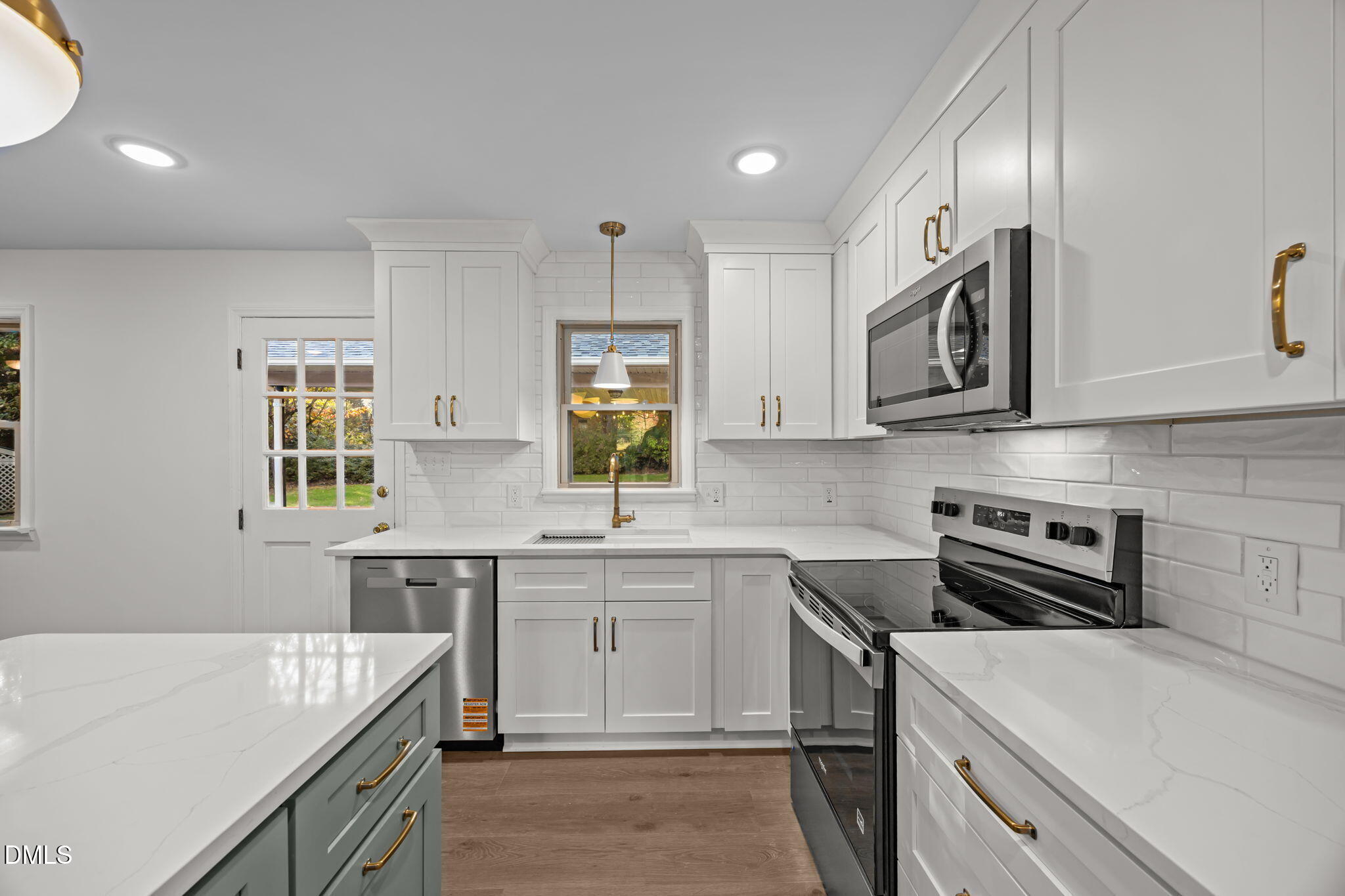 102 Royall Road Oxford, NC 27565 - Photo 12 of 53 a kitchen that has a sink and a stove in it