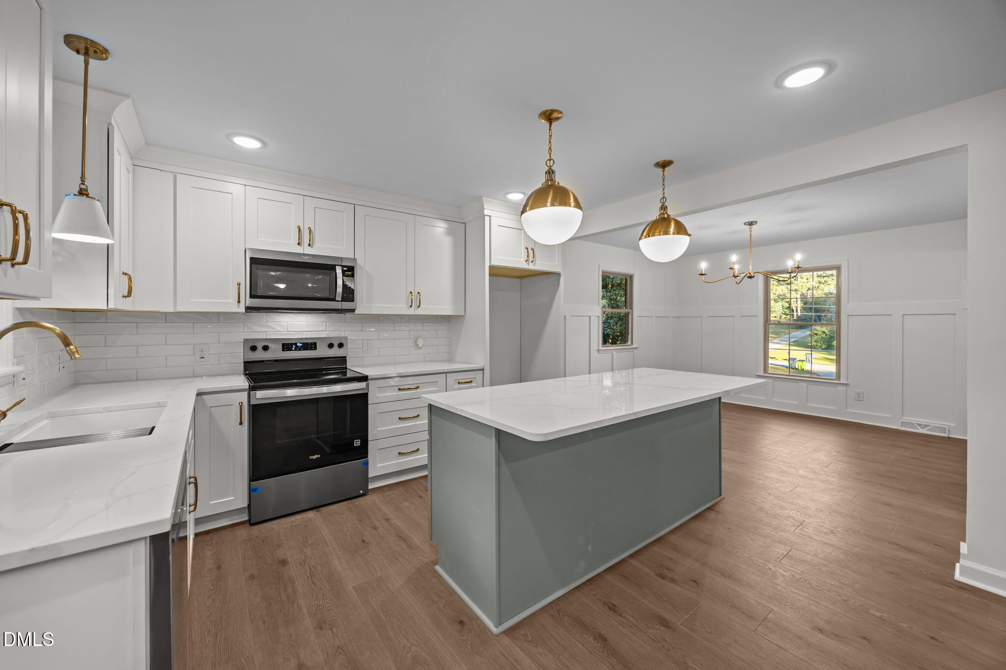 102 Royall Road Oxford, NC 27565 - Photo 13 of 53 a kitchen with stainless steel appliances granite countertop a sink a stove and a wooden floors