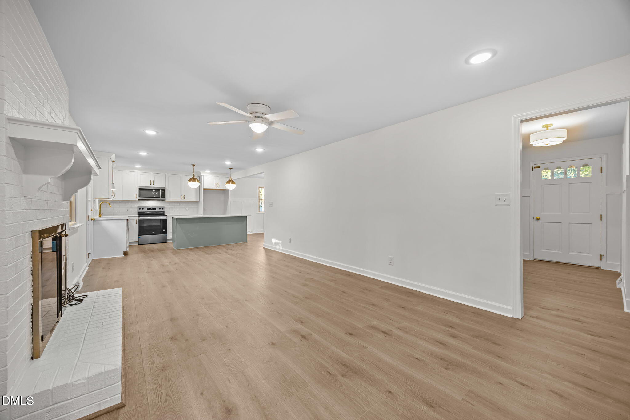 102 Royall Road Oxford, NC 27565 - Photo 2 of 53 a view of kitchen with kitchen island wooden floor center island and stainless steel appliances