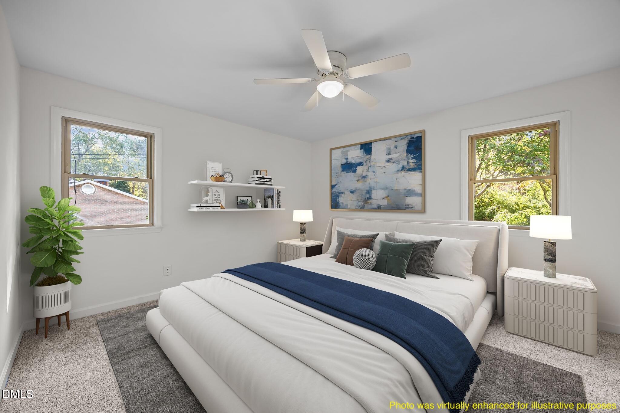 102 Royall Road Oxford, NC 27565 - Photo 23 of 53 a bedroom with a large bed and a potted plant