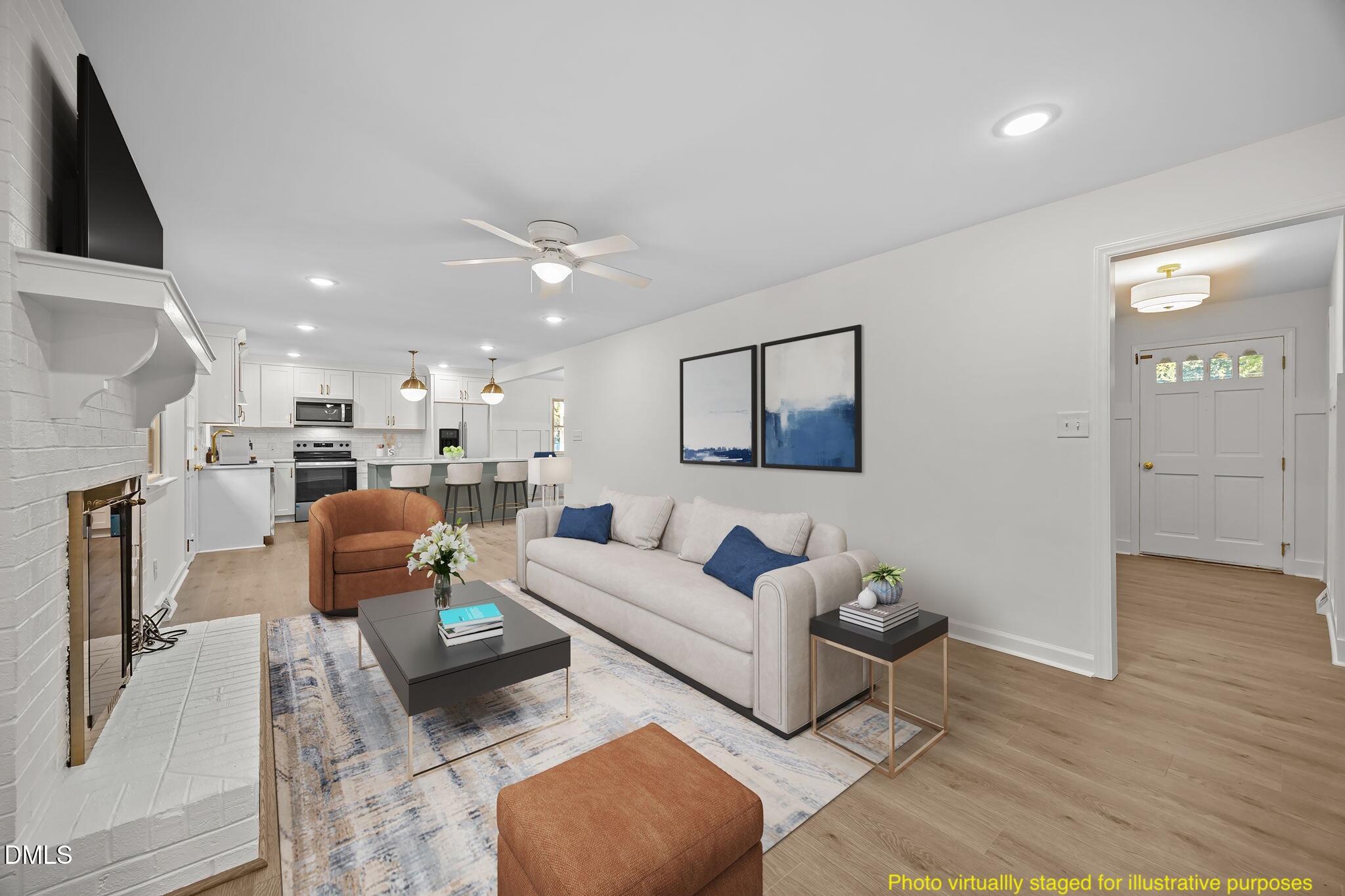 102 Royall Road Oxford, NC 27565 - Photo 3 of 53 a living room with furniture and a wooden floor