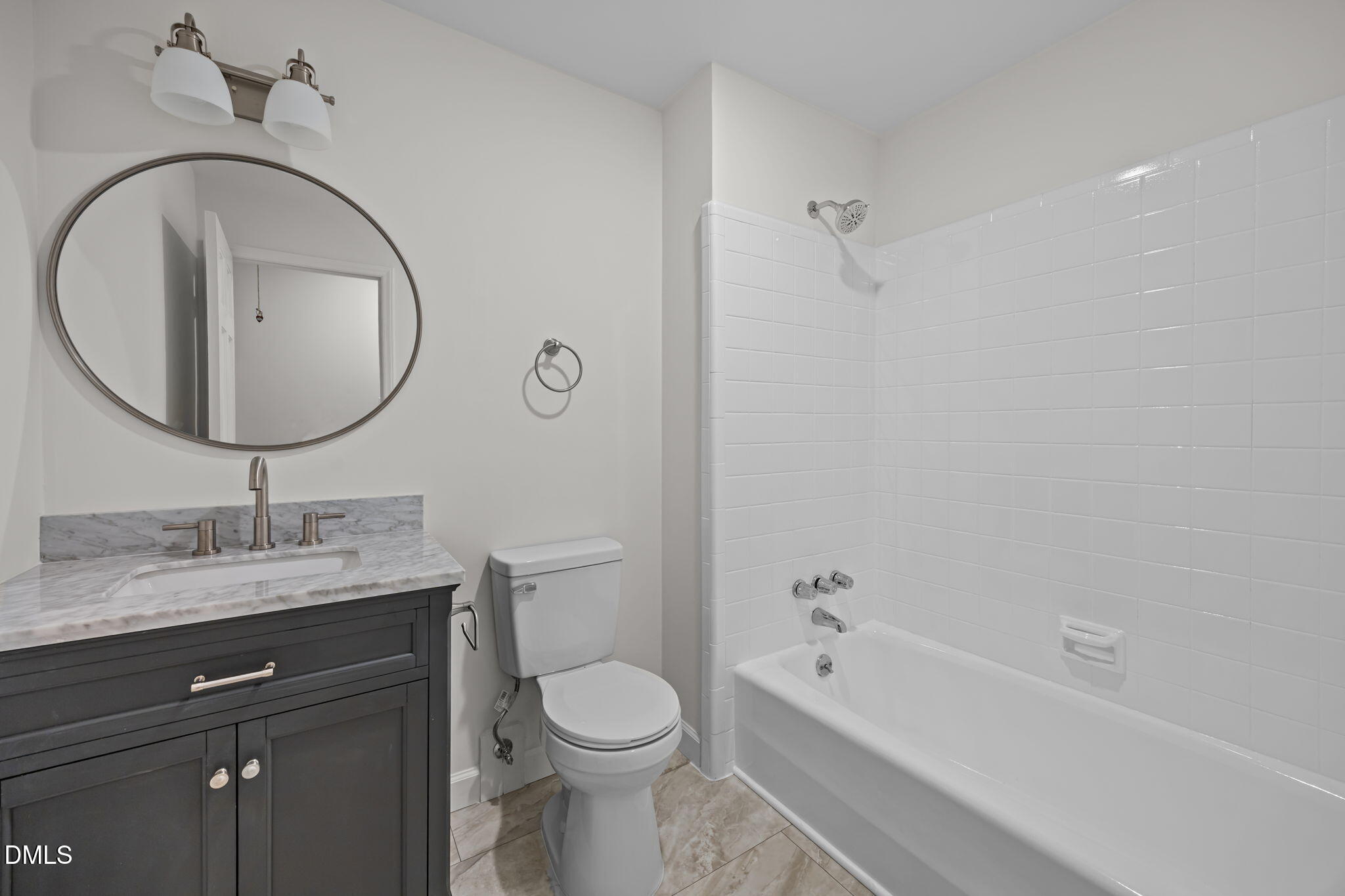 102 Royall Road Oxford, NC 27565 - Photo 31 of 53 a bathroom with a granite countertop toilet a sink and a bathtub
