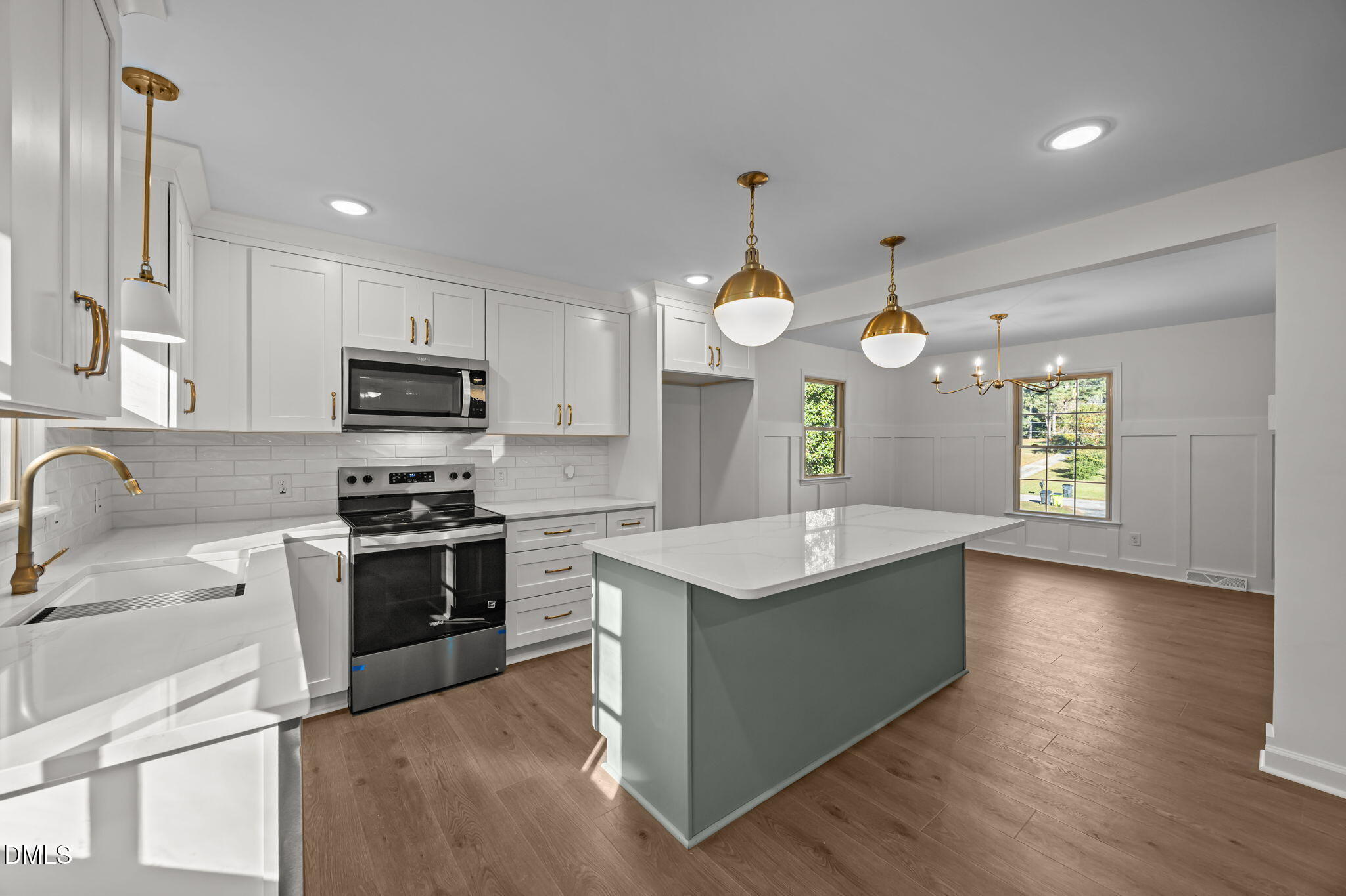 102 Royall Road Oxford, NC 27565 - Photo 8 of 53 a kitchen with stainless steel appliances granite countertop a sink a stove and a wooden floors