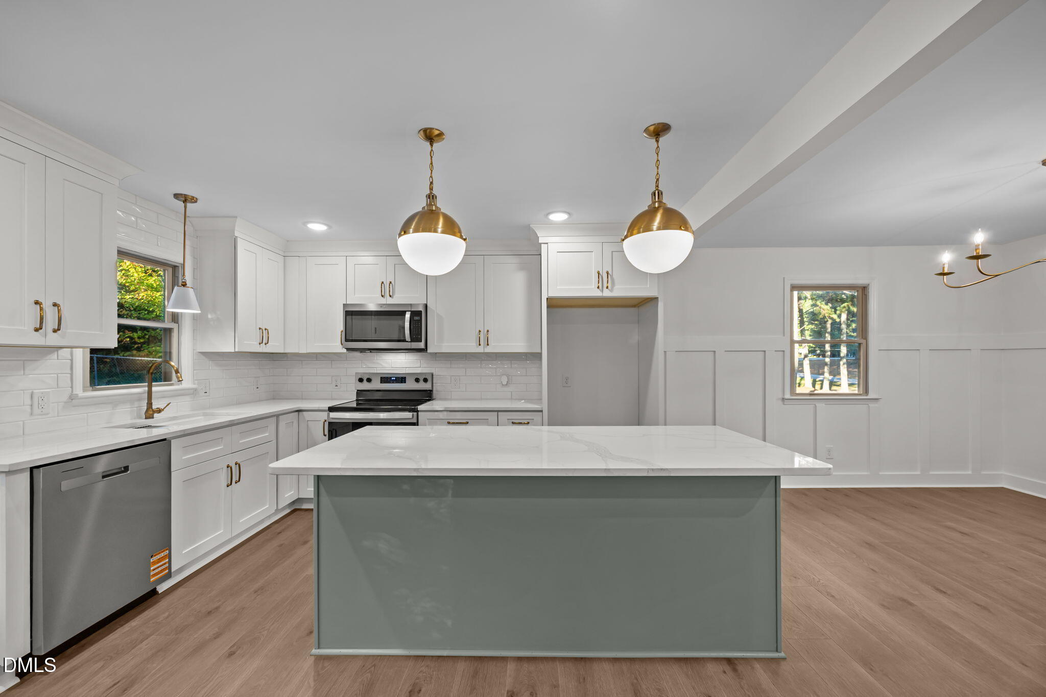 102 Royall Road Oxford, NC 27565 - Photo 10 of 53 a large kitchen with stainless steel appliances granite countertop a sink a stove a microwave a refrigerator and a fireplace