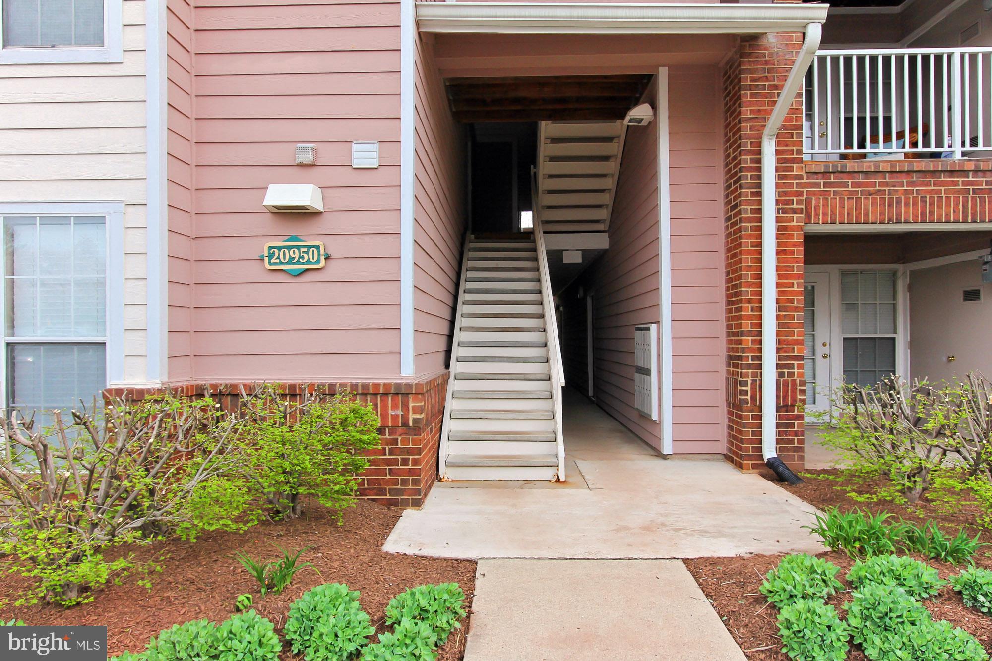 20950 Timber Ridge Terrace, Unit 201 Ashburn, VA 20147 - Photo 3 of 37 Only 1 flight of stairs to the unit
