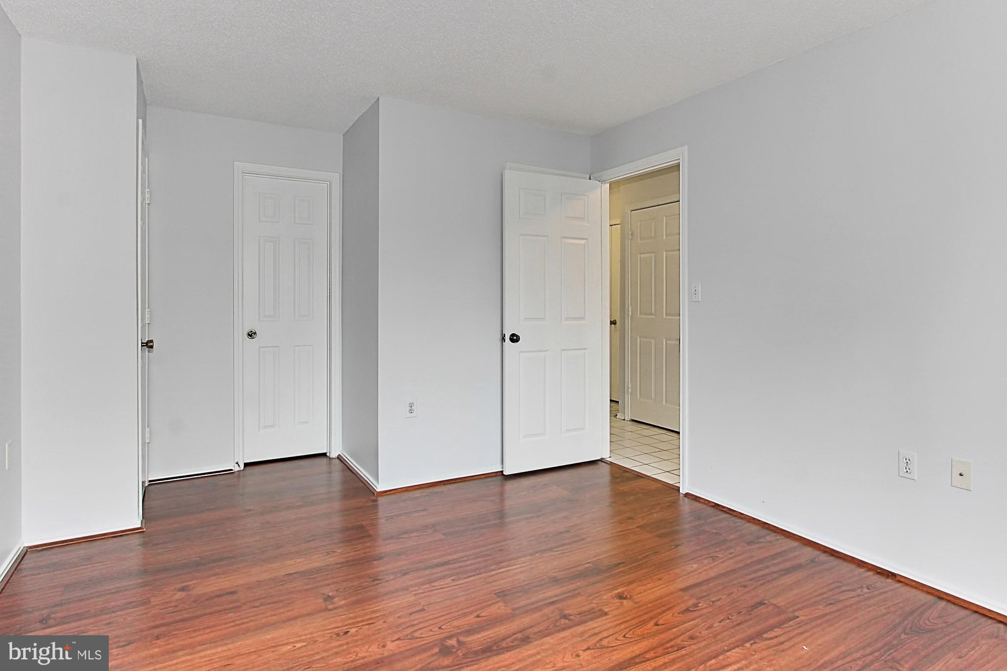 20950 Timber Ridge Terrace, Unit 201 Ashburn, VA 20147 - Photo 22 of 37 Bedroom 2 with walk-in closet and bath