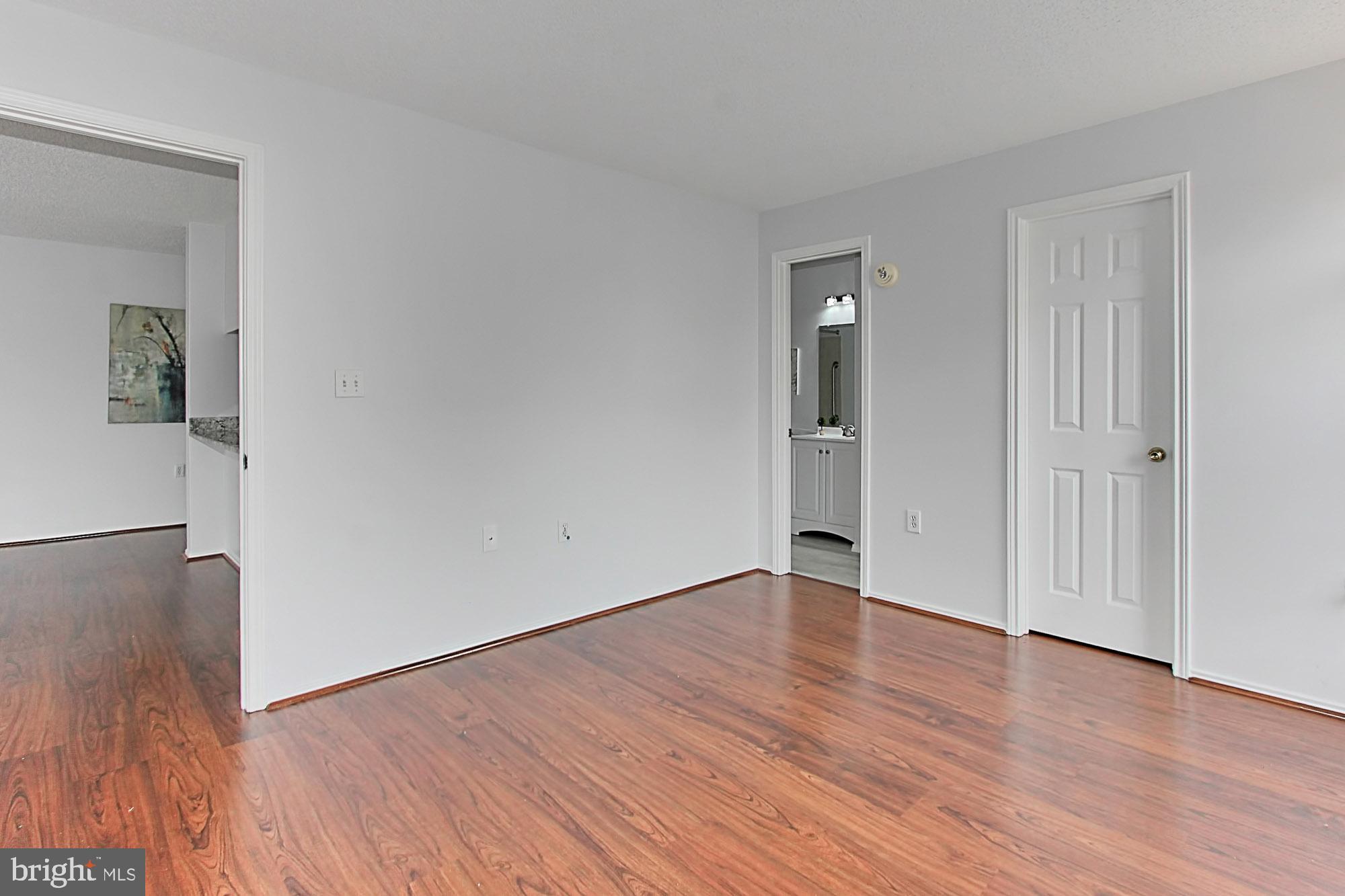 20950 Timber Ridge Terrace, Unit 201 Ashburn, VA 20147 - Photo 23 of 37 Master Bedroom w/walk-in closet and Master Bath