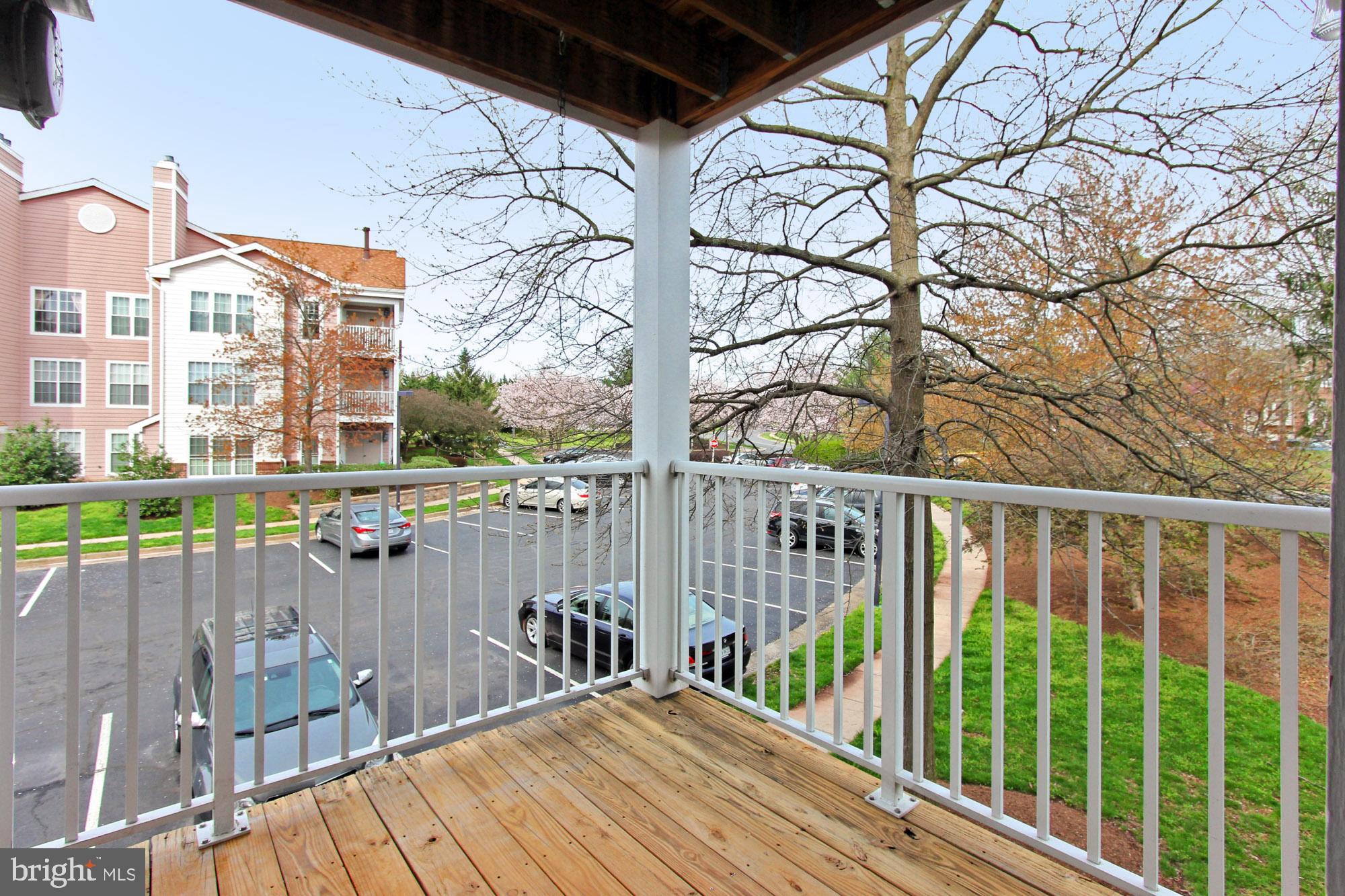 20950 Timber Ridge Terrace, Unit 201 Ashburn, VA 20147 - Photo 28 of 37 Covered balcony deck