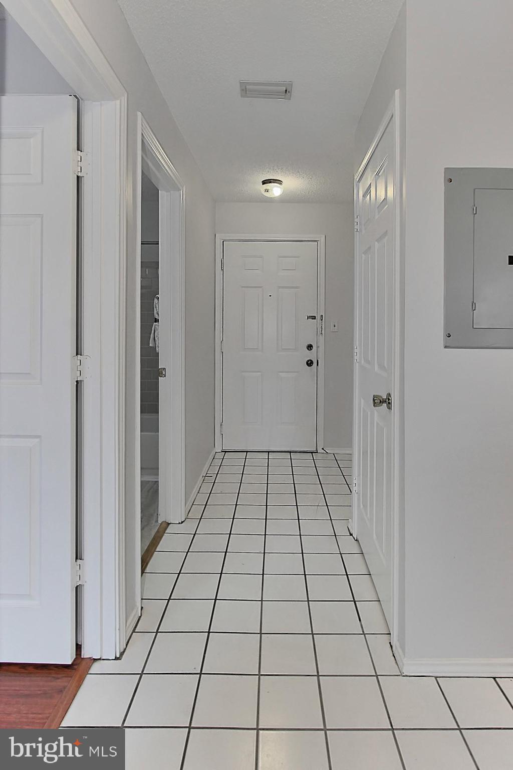 20950 Timber Ridge Terrace, Unit 201 Ashburn, VA 20147 - Photo 31 of 37 Ceramic tile foyer