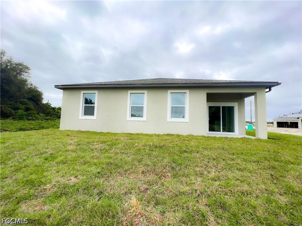 7012 Jolly Circle LaBelle, FL 33935 - Photo 11 of 12 a house view with a garden space