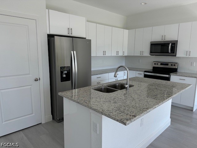 7012 Jolly Circle LaBelle, FL 33935 - Photo 2 of 12 a kitchen with stainless steel appliances granite countertop a sink stove and refrigerator