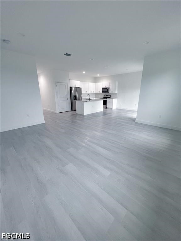 7012 Jolly Circle LaBelle, FL 33935 - Photo 4 of 12 a view of empty room with wooden floor
