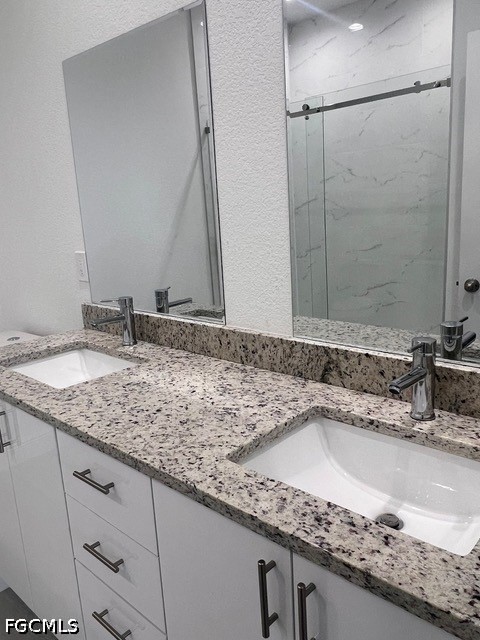 7012 Jolly Circle LaBelle, FL 33935 - Photo 8 of 12 a bathroom with a granite countertop sink and a mirror