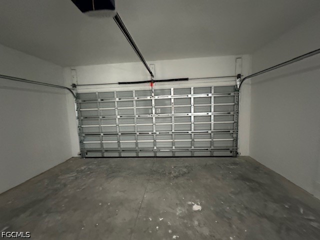 7012 Jolly Circle LaBelle, FL 33935 - Photo 10 of 12 a view of a garage with an empty shelf