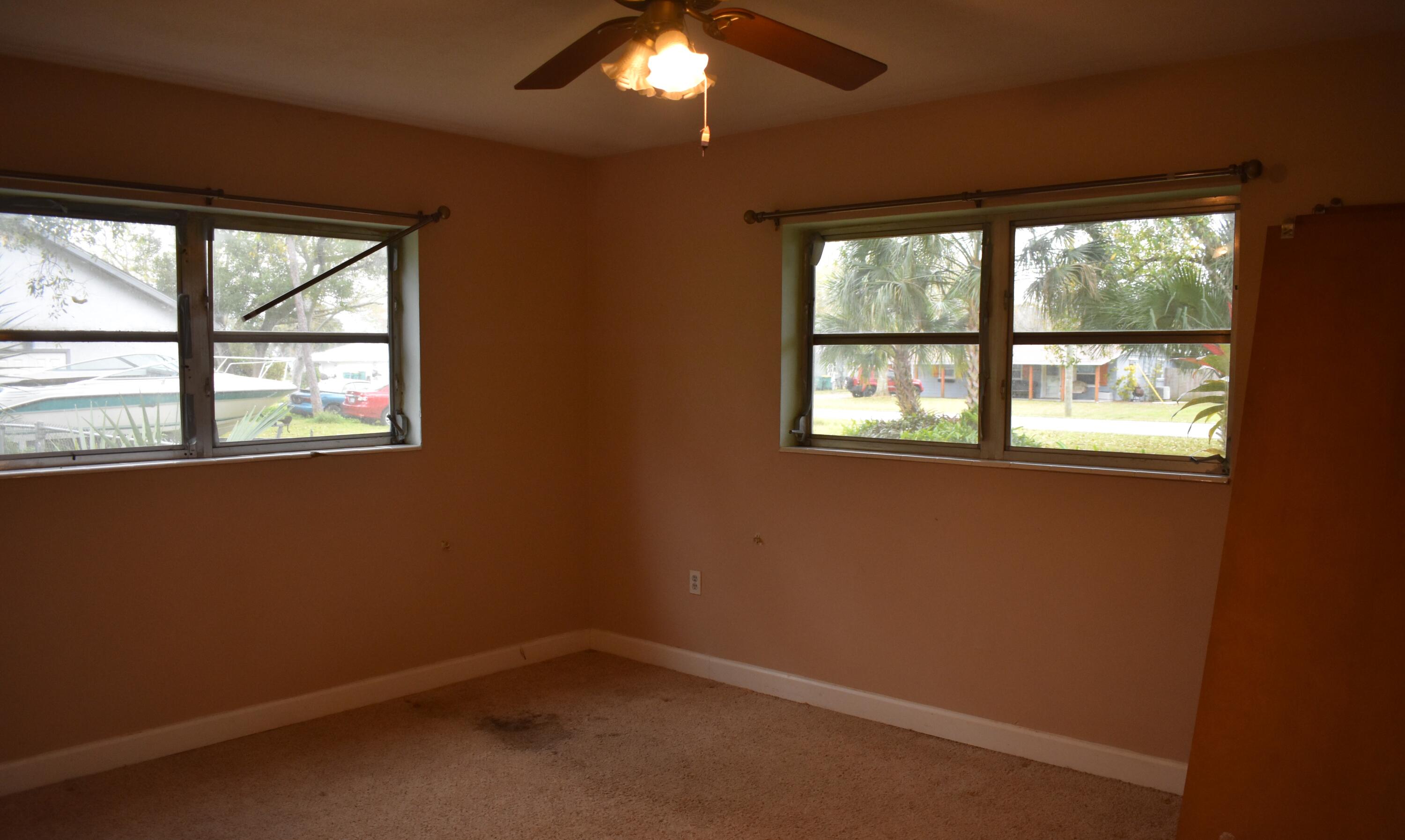 1812 Pinewood Road Melbourne, FL 32934 - Photo 14 of 31 an empty room with a window