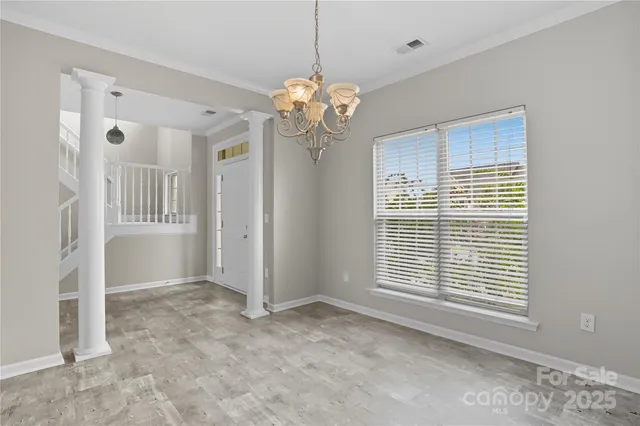 a kitchen with stainless steel appliances granite countertop a refrigerator stove and cabinets