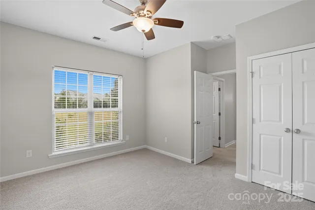 a bathroom with a shower and toilet