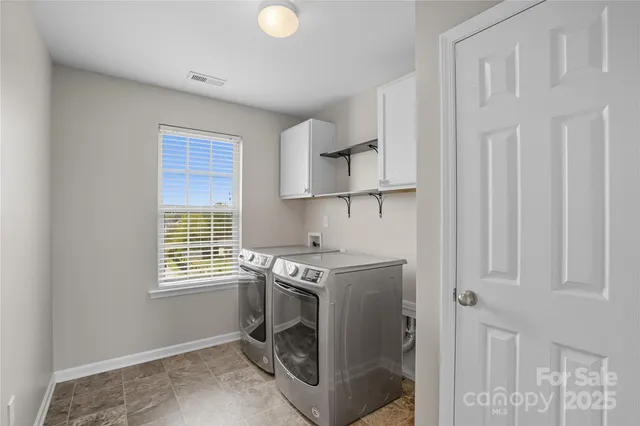 a view of a livingroom with a ceiling fan and window