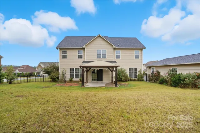 a view of open area with large trees