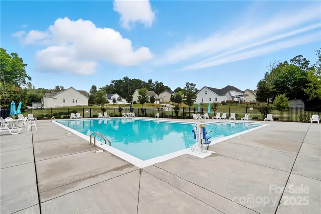 a view of a small yard with wooden fence