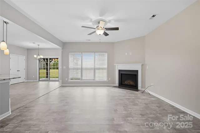 a view of a dining room with furniture and window