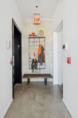 a kitchen with stainless steel appliances kitchen island granite countertop a refrigerator and a stove top oven