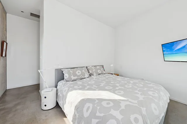a bathroom with a sink and mirror with bathtub