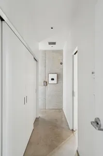 a large white bed in a white room