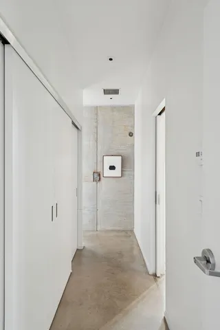 a large white bed in a white room