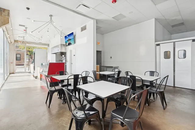 a table that has a table and chairs in it