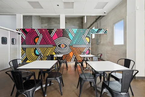 a table that has a table and chairs in it