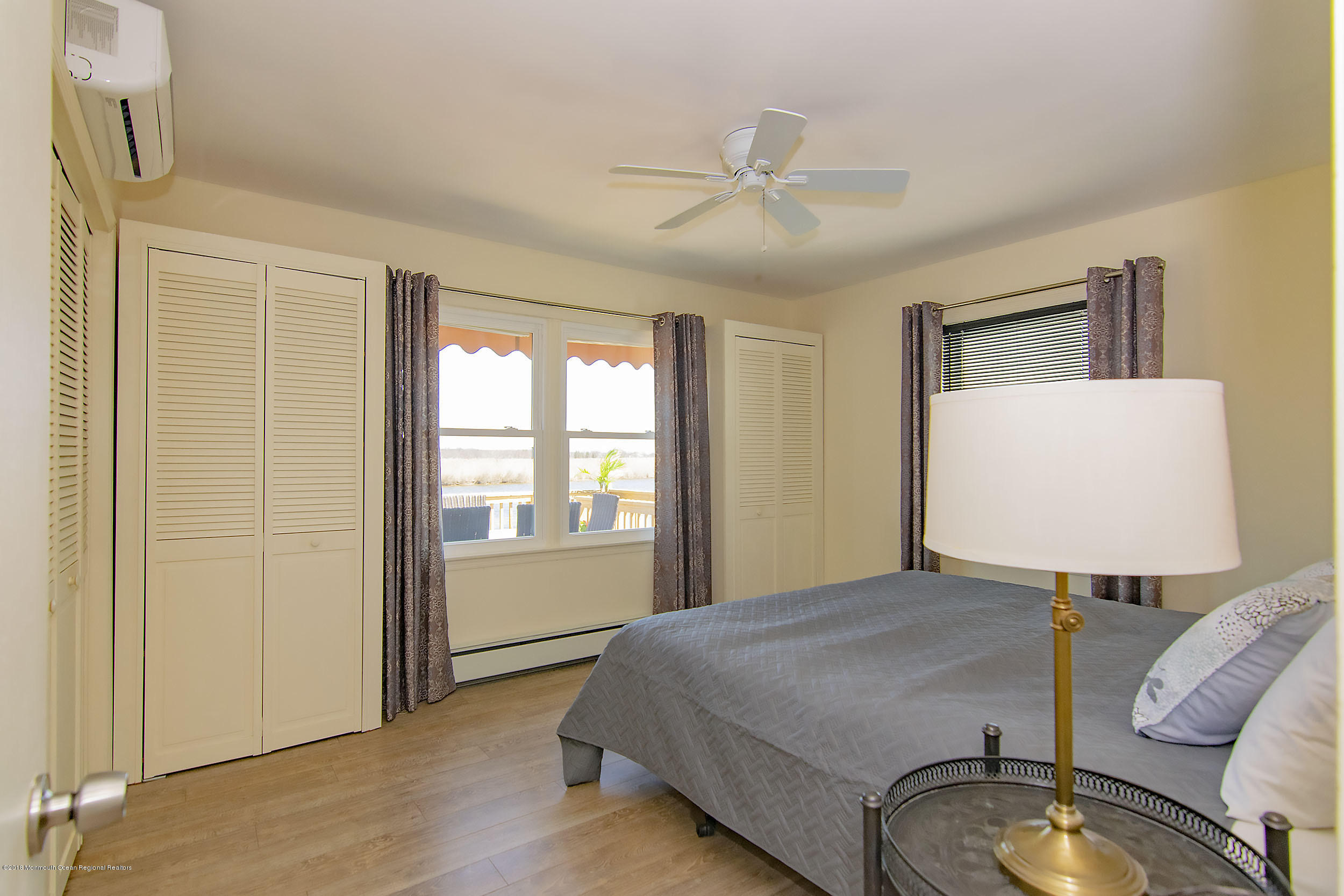 43 Compass Road Waretown, NJ 08758 - Photo 11 of 27 a bedroom with a bed and a window